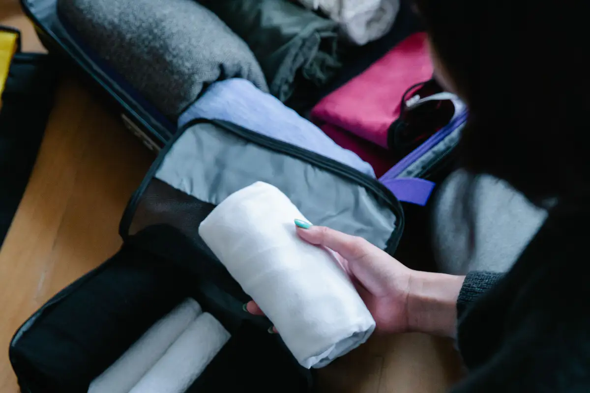 A compact overnight bag packed with folded layers and travel essentials.